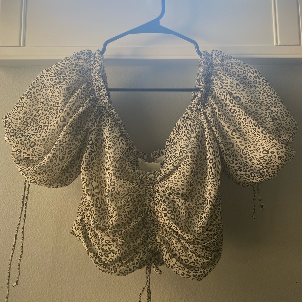 Isabelle’s Cabinet cropped animal print blouse